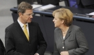 FDP-Chef Guido Westerwelle kündigt harte Gespräche an, CDU-Chefin Angela Merkel beansprucht das Finanzressort für ihre Partei. Foto: dpa
