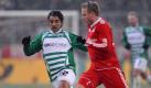 Auch mit einer B-Elf gewinnt der Rekordmeister am Ende klar mit 6:2. Sogar Christian Lell (r.) bekommt bei Bayern mal wieder eine Chance. Sein Gegenspieler Sami Allagui erzielt zwei Treffer - davon geht jedoch einer ins falsche Tor. Foto: dpa