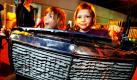 Finn und Nele spielen auf der Musikmesse in Frankfurt am Main bei der Aktion music4kids auf dem alten Kühlergrill eines Mercedes. Schulklassen können hier in einer eigenen Halle mit Musik- und Klanginstrumenten experimentieren.  Foto: dpa