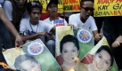 Philippinische Aktivisten verbrennen Plakate der amtierenden Präsidentin der Philippinen Gloria Mcapagal Arroyo. Die Präsidentin hat angekündigt, sich nächstes Jahr wieder zur Wahl zu stellen.  Foto: ap