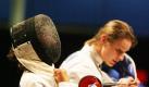 Britta Heidemann (r) nimmt nach der Finalniederlage ihre Maske ab. Foto: dpa