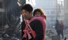 A man and his daughter walk through a devastated street in Kesennnuma, in Miyagi Prefecture, northern Japan, about 350km north of Tokyo, 14 March 2011, after strong earthquakes and tsunami killing more than 1,000 people were hitting northern Japan and Japanese capital of Tokyo area on 11 March. The town hall officials have said they can't contact with more than 10,000 residents yet. Foto: dpa