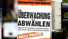 3: Ausgerechnet an einer Überwachungskamera, die Rotlichsünder an einer 
Kreuzung in der Kieler Innenstadt ablichten soll, hängt am Montag 
(14.09.2009) ein Plakat der Piratenpartei. Die Partei hat den Kampf 
gegen Überwachung des Internets zu ihrem Hauptziel im Wahlkampf erklärt. 
Foto: Carsten Rehder dpa/lno +++(c) dpa - Bildfunk+++ Foto: dpa