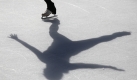 A woman's shadow is cast on the ice while skating at the Safeway Holiday Ice Rink at Union Square in San Francisco, Friday, Nov. 13, 2009. The rink opened this week and will be open through the holidays until Jan. 18. (AP Photo/Eric Risberg) Foto: ap