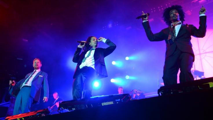 Peter Fox, Frank Dellé und Boundzound der Band Seeed (von links) beim Lollapalooza Festival in Berlin 2015.