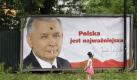 Young girl passes a billboard picturing Jaroslaw Kaczynski, twin brother of the late President Lech Kaczynski killed in a plane crashParliament, in Krakow, Poland, Wednesday, June 16, 2010. Early presidential elections will take place in Poland on June 20, with Kaczynski and acting president and presidential candidate Bronislaw Komorowski, the main contenders. The billboard reads 'Poland is most important'. (AP Photo/Petr David Josek) Foto: ap