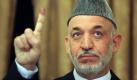 Afghan incumbent President Hamid Karzai holds up his finger, inked purple after casting his election ballot, as he meets with the press in Kabul on Thursday Aug. 20, 2009. Afghans voted under the shadow of Taliban threats of violence Thursday to choose their next president for a nation plagued by armed insurgency, drugs, corruption and a feeble government nearly eight years after the U.S.-led invasion. (AP Photo/Rafiq Maqbool)
 Foto: ap