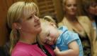 In this May 6, 2010 photo, Jessica Corry holds her 2-year-old daughter, Caroline, during a news conference to launch the Women's Marijuana Movement in the State Capitol in downtown Denver. Moms got tougher drunk-driving laws on the books and were directly responsible for passing and then repealing alcohol Prohibition. Now marijuana activists are trying to enlist the nation's mothers in legalization efforts with a sales pitch that pot is safer than booze. (AP Photo/David Zalubowski) Foto: ap