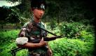 Ein Guerilla-Kämpfer der Karen National Liberation Army steht in der Nähe seiner Station in  New Manerplaw, Myanmar. Der Anführer der größten Guerilla-Armee hat die Regierung vor einem bewaffneten Konflikt mit der Armee des südostasiatischen Landes gewarnt, sofern die ethnische Minderheit der Karen weiterhin unterdrückt werden.  Foto: ap