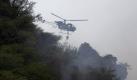 A Pakistani Army helicopter hovers as it looks for survivors of a passenger plane crash in mountains of Islamabad, Pakistan on Wednesday, July 28, 2010. The passenger jet carrying 152 people crashed into the hills surrounding Pakistan's capital amid rain Wednesday, officials said. According to a Pakistani government official over two dozen bodies have been recovered from the site, but many more were feared dead, while several passengers have been rescued.(AP Photo/B.K.Bangash)
 Foto: ap