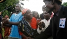 Kenyan family members of U.S. Democratic Presidential candidate Barack Obama, including his step-grandmother Sarah Obama, second left, and a distant cousin Reyson Obama, right, whose grandfather was the brother of Barack's grandfather, celebrate after his victory in the U.S. election was announced, at the family's homestead in Kogelo village, Kenya, Wednesday, Nov. 5, 2008. The village is where U.S. Democratic Presidential candidate Barack Obama's step-grandmother lives. (AP Photo/Matt Dunham) Foto: ap