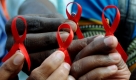 Indian activist display in their hands a `Red ribbon¿ an international symbol of AIDS awareness that is worn by people to mark World AIDS Day, in Bangalore, southern India on 01 December 2009. On the first day of each December, people from all over the world turn their attention to HIV and AIDS for World AIDS Day dedicated to raising awareness of the AIDS pandemic caused by the spread of HIV infection. EPA/JAGADEESH NV +++(c) dpa - Bildfunk+++ Foto: dpa
