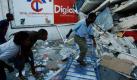 Menschen suchen nach Verschütteten in den Überresten eines Bürogebäudes in der haitischen Hauptstadt Port-au-Prince. Foto: ap