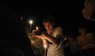 In this photo taken on Saturday, Aug. 7, 2010, an Ossetian boy lights a candle during a ceremony marking the anniversary of the Russian-Georgian war in Tskhinvali, the capital of the Georgian breakaway enclave of South Ossetia. In 2008, Georgia lost control of Abkhazia and South Ossetia. Russian forces crushed the Georgian army in the five-day war that sent Moscow's ties with the West to Cold War levels. (AP Photo/Sergey Karpov) Foto: ap