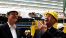 Niedersachsens Ministerpräsident David McAllister (links) und Bernard Meyer, Geschäftsführer der Meyer Werft, unterhalten sich in Papenburg vor dem im Bau befindlichen Kreuzfahrtschiff Disney Fantasy. McAllister besucht während seiner ersten Sommerreise mehr als 20 Stationen, darunter Unternehmen, Welterbestätten und ein Schützenfest. Foto: dapd