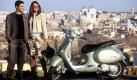 Two unidentified models pose for a photo near a shiny green new scooter GT Italian Piaggio, 25 March 2003 in Rome. The new Vespa was presented yesterday in a press conference. dpa (zu dpa 0408) Foto: dpa