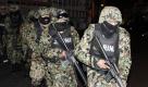 Drogenkrieg in Mexiko: Bewaffnete Soldaten gehen in der Stadt Cuernavaca auf Razzia. Foto: ap
