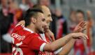 Bayerns Diego Contento (links) und Arjen Robben feiern den Sieg gegen Lyon. Foto: dpa
