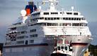Das Kreuzfahrtschiff MS Europa  wird  in Wilhelmshaven in den Hafen geschleppt. Das 1999 in Dienst gestellte Luxus-Kreuzfahrtschiff besucht die Stadt am Jadebusen für einen Tag. Im Herbst soll im französischen Saint Nazaire mit dem Bau der MS Europa 2 begonnen werden, deren Fertigstellung für 2013 geplant ist. Foto: dapd