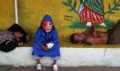 Nach dem rauschenden Fest: In Masaya (Nicaragua) sitzt ein als Teufel verkleidetes Kind zwischen zwei schlafenden Männern. Die Stadt feierte am Wochenende den «Torovenado», ein Fest zu Ehren des heiligen Schutzpatrons San Jeronimo. Foto: dapd
