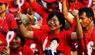 Red-shirted anti-government protesters, some wearing pictures of their idol, fugitive ex-prime minister Thaksin Shinawatra, cheer to speeches at their main protest site near the government quarter in Bangkok, Thailand, on 19 March 2010. The supporters of Thaksin have failed to bring down current premier Abhisit Vejjajiva, despite headline-grabbing blood protests and a rolling rally that reached a peak of 100,000 on 14 March. Police said only 12,000 'Red Shirts' remained at their main rally site in Bangkok with many returning to their homes in the kingdom's provinces after spending up to six days in the capital. EPA/UDO WEITZ +++(c) dpa - Bildfunk+++ Foto: dpa