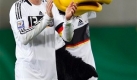 Germany's Michael Ballack, left, and the German team mascott Paule, right, are seen after a World Cup group 4 qualifying soccer match between Germany and Liechtenstein in Leipzig, Germany, Saturday, March 28, 2009. Germany defeated Liechtenstein by 4-0. (AP Photo/Michael Sohn) Foto: ap