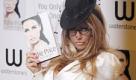 British model and author Katie Price poses with her book, 'You Only Live Once' at a signing in a book store in central London, Thursday, Oct. 28, 2010. (AP Photo/Joel Ryan) Foto: ap