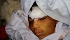 Der Leichnam eines Kindes während einer Beerdigung in Khost, Afghanistan. Eine ferngesteuerte Bombe, die in einem Wasserbehälter versteckt war, tötete sechs Menschen, darunter vier Kinder.  Foto: ap