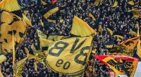 Mit wehenden Fahnen stehen die Fans des BVB hinter ihrer Mannschaft. (Symbolbild)