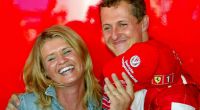 Michael Schumacher freudestrahlend mit seiner Ehefrau Corinna im Sommer 2002.