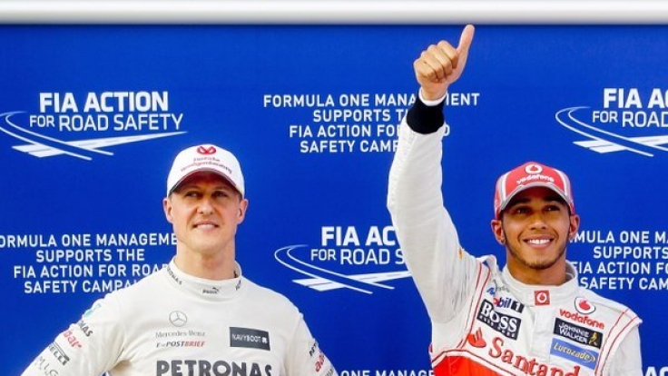 Michael Schumacher (links) und Lewis Hamilton im Jahr 2012 beim Formel-1-Grand-Prix von Malaysia.