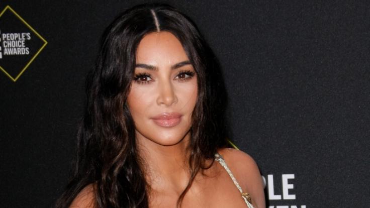 Kim Kardashian sunbathes half-naked!  WITH THIS she gets the fans going