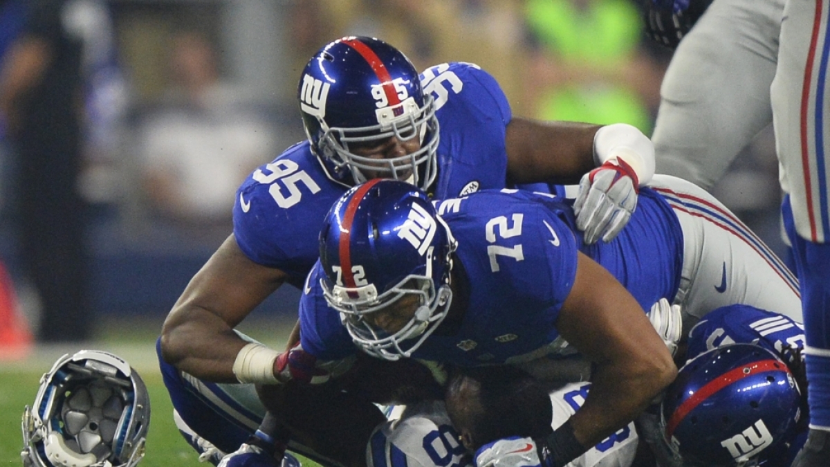 Die Giants liegen auf einem Cowboys Spieler am 13.09.2015. (Symbolbild) (Foto)